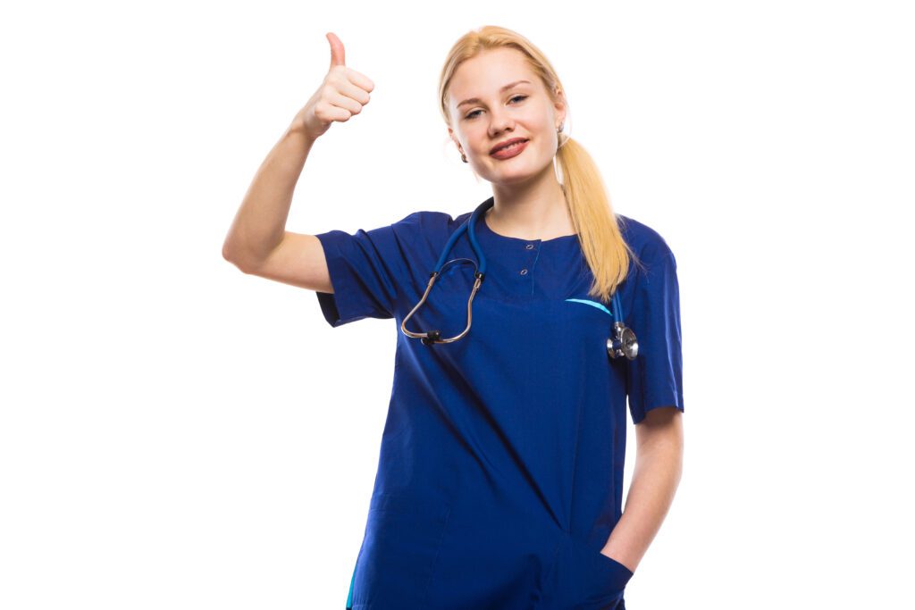Happy woman doctor in blue scrubs